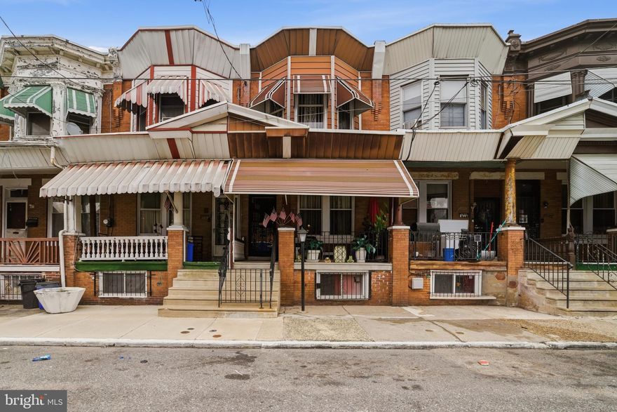 Welcome to 3751 N. Gratz Street, a character-filled home located in the Nicetown–Tioga section of North Philly, offering generous living space, classic architectural details, and convenient access to parks and transportation. The home welcomes you with a covered front porch and a foyer entrance that sets the tone for the interior. Inside, the living room features beautiful original woodwork, a mirrored accent wall, and high ceilings that enhance the sense of space and character. A pocket door leads into the formal Dining room, making it ideal for hosting gatherings. A convenient half bathroom on the main level adds everyday functionality for guests. The eat-in Kitchen offers a gas range and oven with exhaust hood, double stainless steel sink, and a steel door exit to the spacious fenced rear yard, where you’ll also find the central air condenser. High ceilings continue throughout the main level, adding to the home’s open feel.
Upstairs, the second level accommodates three spacious bedrooms, each with high ceilings and ceiling fans, along with a large 3-piece hallway bathroom featuring a stall shower. The finished lower level provides excellent bonus space, including a bar and entertainment area, powder room, and ample storage. This level also houses the gas hot water tank and furnace, offering comfort and convenience year-round.
Residents enjoy proximity to several neighborhood highlights, including:
*Hunting Park, one of Philadelphia’s largest parks, offering trails, athletic fields, and open green space.
*Nicetown Park, a community-focused recreation space with sports courts and outdoor amenities.
*Broad Street Line & Erie Avenue Transportation Corridor, providing easy access to Center City and surrounding neighborhoods.
With its blend of character, space, and location, 3751 N. Gratz Street offers comfort and versatility in a well-connected Philadelphia neighborhood. While this home has been extremely well cared for, and is in move-in condition, the Seller is offering the property “as-is”, and any potential lender, or 1st time Buyer program, required repairs would be the Buyer’s responsibility. Please take a minute to view the video tour and then schedule your in-person showing, today!