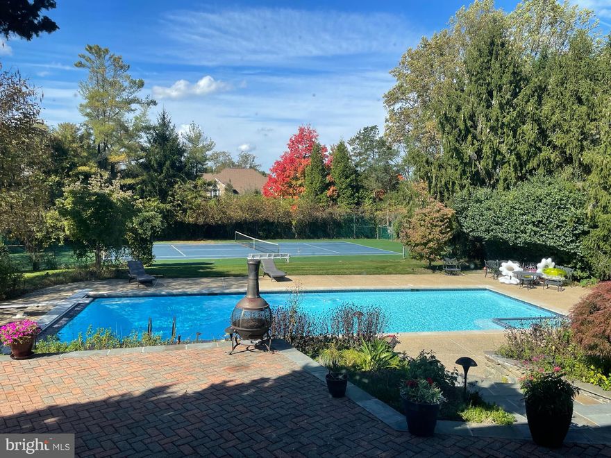 Welcome to the heart of Potomac.  6,200 + sq ft, 5-bedroom, 6.5-bathroom masterpiece.  Positioned in a prime location, this home redefines luxurious living, offering an oasis of serenity with an impressively large pool and tennis court, ensuring endless outdoor entertainment for you and your loved ones.
This property's location is a homeowner's dream, with unparalleled access to all amenities. Not only does it feature a 2-car attached garage, but it also includes a separate 2-car garage complete with an in-law suite, perfect for hosting guests or accommodating extended family. 
Inside, you'll find an abundance of natural light and a thoughtfully designed circular floor plan that's perfect for large-scale entertaining. From the dramatic vaulted ceiling in the family room to the formal living and dining areas that can comfortably seat 12 or more, this home offers a grand stage for your gatherings. A separate library provides a quiet retreat, and the kitchen with its elegant quartz center island is a chef's delight.  Additionally, there's an au pair suite, adding versatility to your living space.
Neutral wall space and stunning hardwood floor throughout create a sophisticated backdrop, just waiting for your personal touch. The outdoor space is equally enchanting, featuring a sprawling paver patio that's ideal for hosting events while basking in beautiful sunsets.
This property is an entertainer's paradise, with a pristine pool boasting inviting blue waters, a tennis court, a golf putting green, and lush gardens with mature trees and greenery that ensure peace and quiet behind a private fence, making every season truly wonderful.  
This home is a sanctuary that perfectly encapsulates the charm of Potomac living. It's offered AS IS with numerous upgrades, creating an exceptional canvas for you to transform into your dream home. Don't miss this rare opportunity to make this remarkable property your own.
