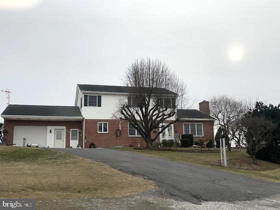 Upcoming Auction April 5th @ 12pm.
1.55 Acres, Large 2 Story Brick & Vinyl sided Home w/ Approx. 3,000 sq. ft. of living space; Home was built new by Ray & Marie in 1964, many updates & renovations since; Large modern eat in kitchen w/ custom oak cabinets, Wall Oven, built in dishwasher, Refrigerator, flat top oven w/ overhead microwave, Large amount of cupboard space, Large living room w/ hardwood floors, & fireplace insert; 1 bedroom & full bath on main level, office/study; Large all season room w/ Pine Cathedral ceiling, double doors from room leads to large covered patio area, open patio w/ waterfall; Second level includes 3 bedrooms, 1 large full bath including master bedroom w/ walk-in closet, Walk-in cedar wardrobe, clothes chute, plenty of storage space; Attached 1 car garage w/ workshop area, Full basement, partially finished w/ outside entrance, Home heats w/ outdoor woodstove, & oil burner, forced hot water heat; 200AMP service, onsite well, & septic, 30x40 enclosed shop/garage pole building w/ sliding front doors & man doors on ends; 10'x30 lean to addition, 16'x20' board & batten workshop/garden shed; beautiful views of mountain from this property; This home has been well maintained by owners, very nice property, owners have enjoyed this home for 60 years, & are downsizing, come prepared to buy;