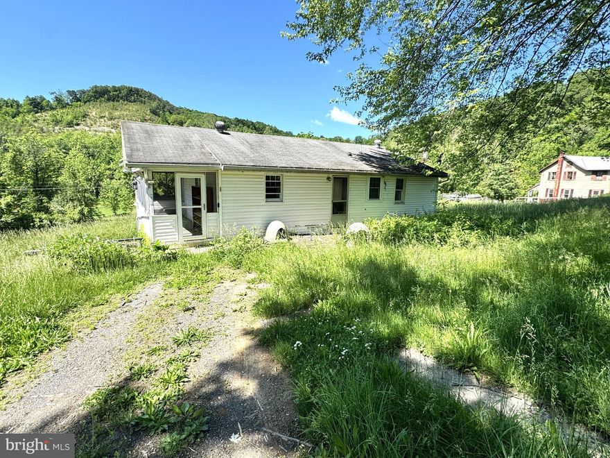 Amazing views are found on the top of this beautiful 10.7 acre farmette. Sitting along a country road you will find this cozy home with horse pasture, barn, and land to roam. This property features a 1/2 bedroom house, screened in porch, & integrated garage. Covered pavilion and block shed, horse stable and run in shed with stalls, hay storage, feed/ tack room & additional storage shed, all with electric and water. Plastic coated horse fenced in pasture and trails up around the fields. Many opportunities await this property as you could make this home suit your needs or build your dream home overlooking the pastures, and take in the stunning mountain views.