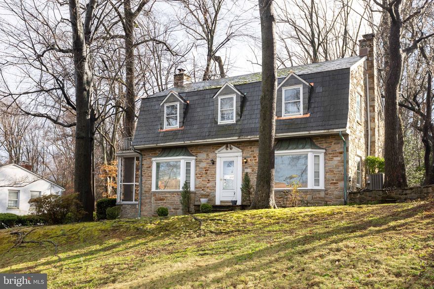 Set on nearly an acre in Towson’s coveted Fellowship Forest neighborhood adjoining the Country Club of Maryland, this lovingly maintained home offers classic character, generous space, and more than four decades of careful ownership. Recently refreshed in 2026 and thoughtfully improved, the property blends timeless charm with meaningful updates.

The main level features warm and inviting living spaces highlighted by large bay windows that fill the home with natural light and a striking stone fireplace that creates a beautiful focal point and cozy gathering space.

Upstairs, the spacious primary bedroom offers generous proportions and excellent closet space, while the second and third bedrooms are both nicely sized and filled with natural light. A full-sized attic provides abundant additional storage space.

The refreshed basement offers additional living space including a family room, bathroom, and a vintage wooden bar that creates a fun and distinctive area for entertaining, relaxing, or hobbies.

Outside, the property includes a two-car garage with a large attached shed, providing excellent storage for tools, equipment, and outdoor gear. The partially fenced property spans nearly an acre, offering an exceptional amount of outdoor space rarely found in Towson.

Recent 2026 upgrades include a brand-new high efficiency furnace, basement improvements including layout changes, upgraded electrical, and freshly painted floor/ walls in the storage, utility, and gym areas. Additional recent work includes porch resealing with new screens, garage cleaning and repainting with Kilz, roof refresh with slate replacement, and new carpet installation with professional cleaning (2026).

Major system updates include a water heater replaced in 2023, garage roof replacement in 2019, and a professionally waterproofed basement with French drain system installed in 2015. The home’s slate roof has been professionally serviced at least every other year, helping ensure its long-term durability and performance.

Ideally located close to shopping, dining, parks, and major commuter routes, this home offers a rare opportunity to own a beautifully maintained property with space, character, and decades of careful stewardship.