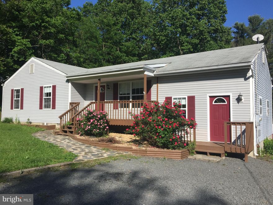 Immaculate condition.  LARGE FAMILY ROOM could be used as  4th bedroom. Plenty of parking space. Kitchen has breakfast bar. Mater bedroom has two closets. BEAUTIFUL TREES IN  BACK YARD WITH 3 DECKS,  PLUS A PATIO.  Located on quiet  cul-de-sac lane only two streets from lake with boat ramp, fishing, and beach for swimming,  Enjoy the mountain view from the front porch. Don't miss out.