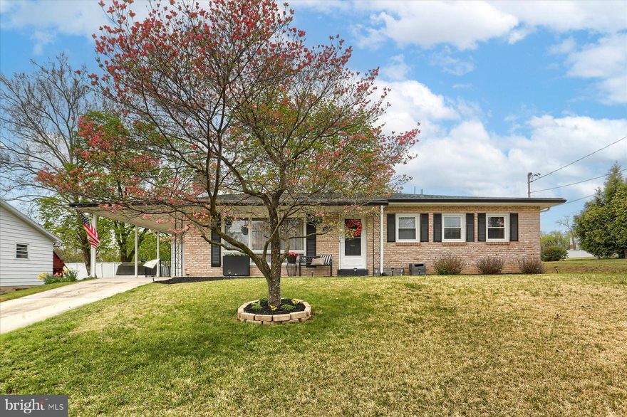 Discover this delightful ranch home nestled on a peaceful cul-de-sac, boasting exceptional curb appeal. Enjoy a fenced in yard with updated landscaping, an expansive patio with a hot tub and gazebo, plus valuable upgrades like a radon mitigation system, new electric water heater, and reverse osmosis. Inside, find a sun-drenched living room with hardwood floors, a wood burning fireplace with surrounding built-in shelving. The kitchen is fully equipped with appliances, vinyl flooring, and an eat in area. All bedrooms feature hardwood floors and ceiling fan/light fixtures, with two of the rooms offering chic barn door closets. The full bathroom has a double vanity and tub/shower. Energy efficiency is enhanced by added insulation and an attic fan. The partially finished basement provides a cozy living area with a wood burning fireplace and wet bar. The unfinished area houses laundry, a utility sink, workshop space, and backyard access via a Bilco door. Outside, the property features a carport, two sheds, and a generator hookup. This is the perfect place to call home—well-cared for, thoughtfully updated, and ready for its next chapter!