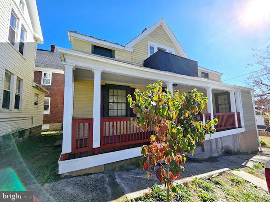 Step back in time when you enter this spacious hidden gem! Tall ceilings, wood floors, two fire places, French doors, a Juliet balcony, solid wood doors with original keyhole door knobs, a wood burning stove plus all of the little nooks and crannies that were built into homes from the 1920s.  Previous owners have  done well keeping the integrity of the house. Fresh paint is being added to the upstairs rooms.  The downstairs has two large living areas, one with a fireplace and charming side alcove. The kitchen boasts spaciousness as well as beautiful wood cabinetry with a dining area just adjacent that has French doors that open that open to a living room. There's also a lovely half bath downstairs. Upstairs, the primary bedroom has its own full bath along with a cozy side alcove perfect for curling up with a cup of tea. The basement is spacious and partially refinished.  It could easily be an extra room for entertaining. The gas furnace and electric hot water are recent and in working order.  The wood stove is located in the basement, as well. The house stays toasty on these chilly winter days. It just needs the final touches. It is being sold "as-is". The home is located on a quiet side street and is not far from historic downtown Cumberland, the C&O canal, GAP trail, UPMC, local shopping and much more. Don't miss out on getting a piece of Cumberland's history!