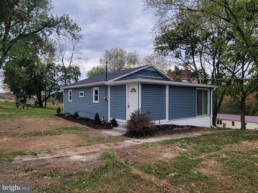 Newly remodeled ranch house on 1.45 acres with beautiful country views. Property has a second home and provides $6,000 a year in rental income. Main house has 2 bedrooms, 1 full bath, and everything was just remodeled. New siding and roof on the main house and large garage. Some of the windows were just replaced. Inside has a new kitchen, new full bathroom, and all new flooring throughout, including carpet in the bedrooms. Newly painted throughout as well. New lighting, interior doors and molding. The basement has a new electric panel and well pump and is a walkout in the rear.