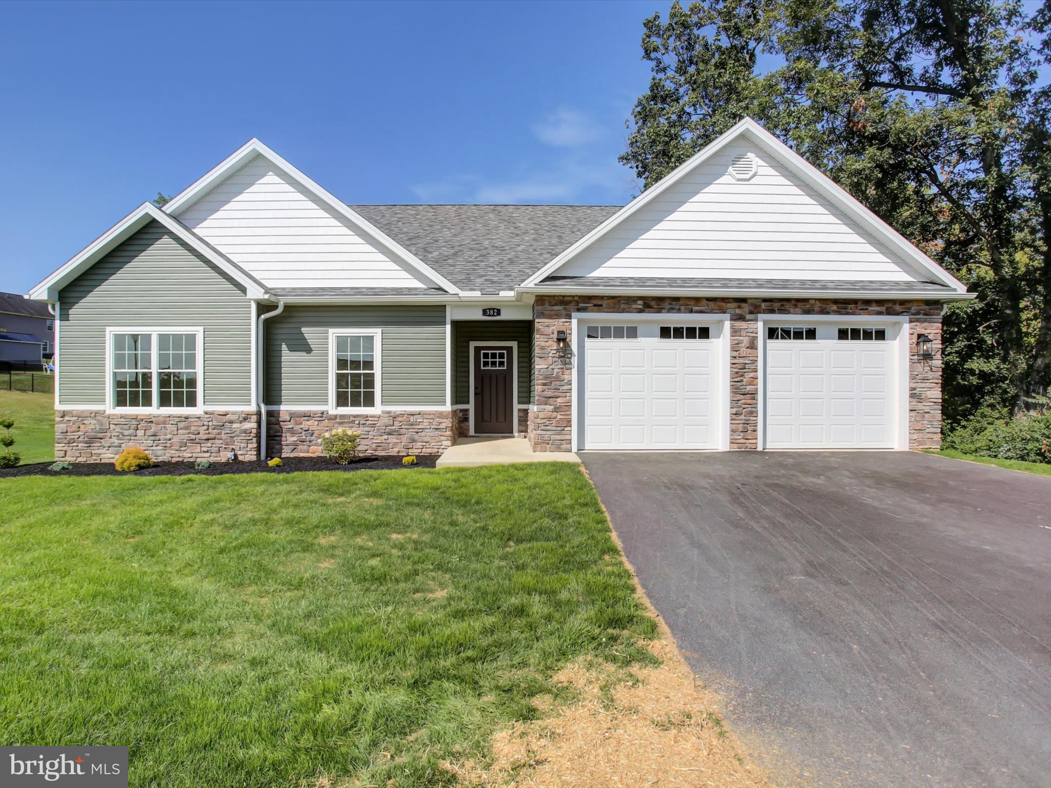 NEW CONSTRUCTION! Rare Find...new 1 story, no steps, 3 bdrm, 2 bath home in Greencastle with private .47 acre lot that offers room to expand in the full walk-out to grade basement. This quality home by Comstock Builders features several custom options such as arched entry to Great Room, LVP flooring, granite kitchen & baths, 9' ceilings, 36" doors throughout, composite deck & concrete patio. The natural light pours into this home making you feel great! The 2 car attached garage w/2 doors is spacious and the full basement offers tons of storage or future living space w/natural light & sliding door to patio. The lot is larger than it looks as the trees in the left rear corner are all on this property. The cul-de-sac street provides low traffic count and the trees in the back provide private backyard setting. Great neighborhood for walking, yet convenient to everything. It's not just another new build--the craftsmanship shows!