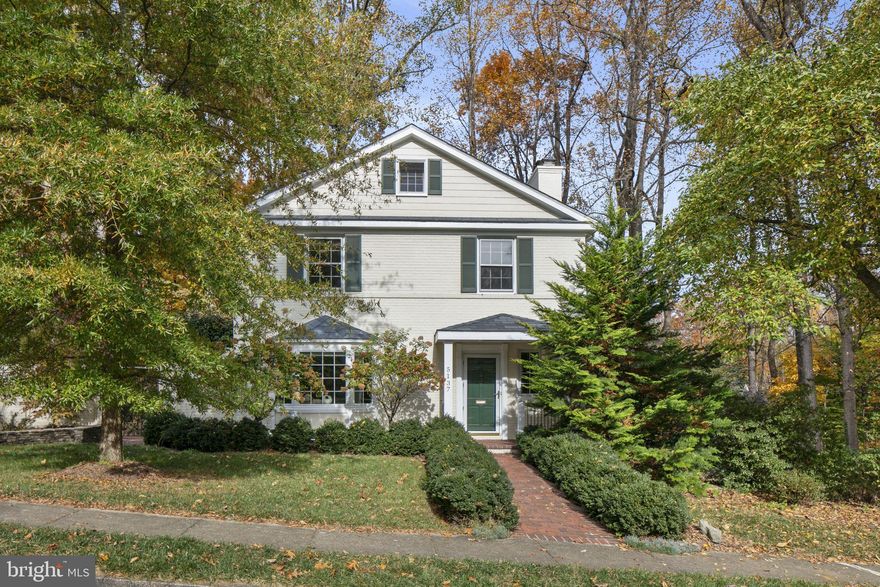 Looking for a house to call home? This special property is tucked into the Woodland Acres neighborhood. Homes are rarely listed here, and this residence sits on a cul de sac within easy reach of Chesterbrook Shopping (.8); Discovery Elementary (.5); Williamsburg Middle (.4); Yorktown High (1.1); numerous parks; and Arlington and McLean. Gorgeously sited on a .33 acre lot, this painted brick residence welcomes you with its green shutters, mature plantings, and a garden gate leading to a walled garden and side yard.  A spacious open floor plan begins with the lovely front porch and foyer which open to the living room - with gas fireplace, ample built-ins, and wall space for art. The circular flow on the main level ensures easy living and entertaining spaces: a formal dining room at rear of home overlooking the rear yard, updated eat-in kitchen with multiple pantries for storage, a welcome home office with door to garden, and a family room that could double as the home's fifth bedroom - as this home enjoys a full bath on the main level. Venturing to the upper level one finds a primary suite with bathroom offering dual vanities, tub and walk-in shower. Three additional bedrooms - not a one would be considered small - and a second full bath complete the upper level. The lower level is a fully walk-out level providing entry from the 2-car garage, spacious laundry/storage room with half bath and the comfortable family room with second fireplace. The utility room also functions as a workspace for projects. The exterior of this home sees a deck for dining and entertaining as well as the walled garden with flowering bushes, trees, and plantings. This property feels at home amongst the  trees and offers its owners a lovely refuge - but its proximity to schools, shopping, parks and main roads ensures easy access to daily conveniences.