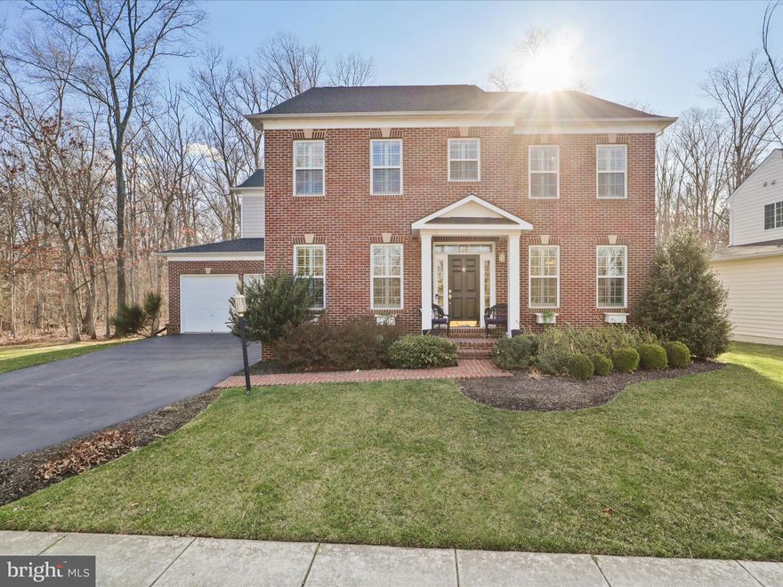 Stunning 4 Bedroom/3.5 bath brick front colonial featuring 4160 Sq Ft on 3 fully finished levels in highly sought after Greene Mill Preserve!  This home sits on a premium 1/4 acre lot that backs to 100 acres of woods and is next to a "tree save lot" for additional privacy!  This elegant home features gleaming hardwood flooring throughout the main and upper levels, Plantation shutters throughout, oversized rooms built for entertaining including formal living/dining rooms, a stunning family room w/ gas fireplace and built-ins, and a gourmet kitchen w/ island, granite counters, custom backsplash, pendant lighting and more!  The upper level features a grand primary suite w/ tray ceiling, walk in closet and luxury bath w/ dual vanities, soaking tub and stall shower.  There are 3 additional bedrooms and full bath on this level.  The walk up lower level is wide open and finished for entertaining, game nights, or a future theater room and features a full bath and lots of storage.  Entertain friends and family in your private, tree-lined backyard oasis featuring a stunning screened in porch, composite deck, flagstone patio and custom firepit!  This beautiful home is just a short drive to new shopping and restaurants, Brambleton town center,  local craft breweries and wineries, and more!  Independence HS Pyramid!