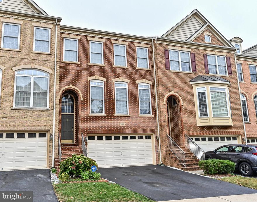 Beautiful 2 car garage townhome in Faircrest! This Colonial brick front townhome is full of natural light. Gleaming hardwood floors on the entire main and upper levels. Large family room with gas fireplace, recessed lighting, double molding in the living and dining room. Gourmet  kitchen features granite countertops, 42 inches maple cabinets, newer stainless steel refrigerator, cooktop with auto downdraft vent, center island with bar seating, access the deck from the kitchen. This townhome also offers an incredible lower level, complete with a full bathroom, a storage/utility area with extra large size washer and dryer. Huge size of basement with another fireplace and glass door that walks out to your fenced-in backyard with brick patio. The master suite includes a separate make-up vanity, dual sinks, a stand-up shower and a corner soaking tub. All three bedrooms have vaulted ceilings. Short walk to walking/biking trail. Close to Stringfellow Road Park & Ride - a convenient hub for the Fairfax Connector with frequent runs to Vienna Metro Station. just minutes from schools, shopping, and dining with easy access to I-66, RT 29, and RT 28.