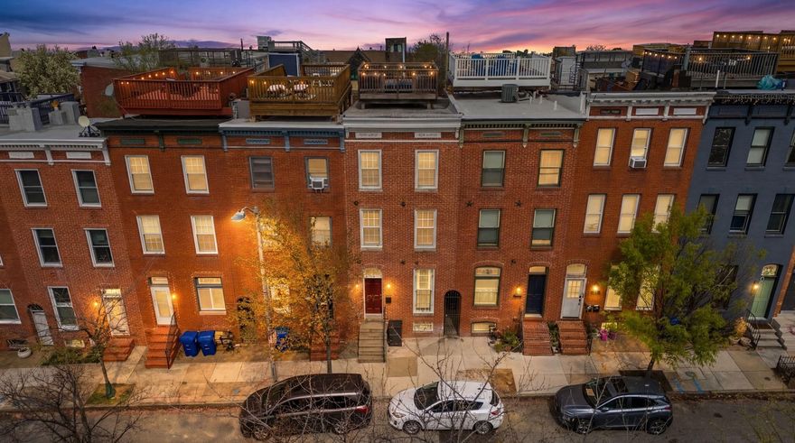 ***OPEN HOUSE: 1-3 PM ON SATURDAY, APRIL 11TH*** This fabulous and updated Butchers Hill rowhome is perfect for City living! Only a few blocks from beautiful Patterson Park, it has abundant living space, private parking, and a roof deck. It is also nearby to Johns Hopkins Hospital, restaurants, shopping, and the Fell's Point/Canton waterfront. The main level has an inviting open layout with a bright living room, separate dining area, half bath, and stunning kitchen. The kitchen has a large island, Viking cooktop, stainless appliances, breakfast nook, and extensive cabinetry with integrated lighting. French doors in the kitchen lead to the parking pad and sally port. The second level offers two spacious bedrooms, laundry and full bath. The third-level primary suite has a bedroom with vaulted ceiling, walk-in closet, and private bath. The primary bathroom features a soaking tub, separate shower, double vanity and heated floor. The lower level has a versatile finished flex space, full bath and large utility/storage room. The living space continues outdoors with multiple decks. Including the rooftop deck which has amazing City views! This well maintained home was fully renovated in 2017 and has so many amazing features. Schedule a tour today!