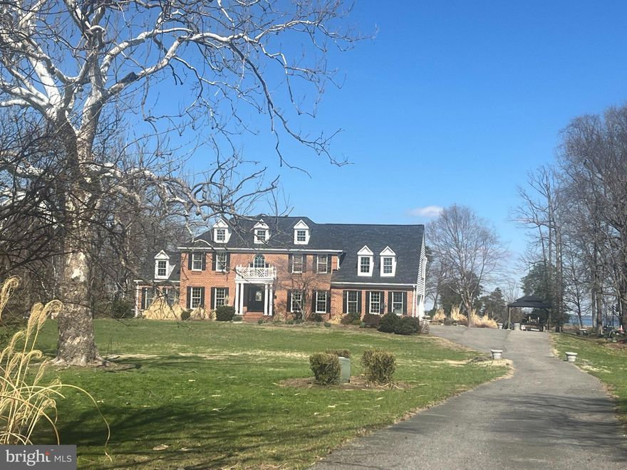 Set on Forty Five picturesque acres of prime agricultural land with extensive tillable acreage, this exceptional Five bedroom, Four and one half bath brick colonial blends timeless design with modern versatility and waterfront charm. Privately situated on a quiet cove just off the mouth of the Chester River, the property offers a rare combination of space, functionality, and lifestyle appeal. Inside, the home features a thoughtfully designed layout ideal for both everyday living and entertaining. A main-level en-suite provides excellent flexibility for multi-generational living or private guest quarters, while an additional upper-level en-suite enhances comfort and convenience for visitors. The spacious primary suite serves as a true retreat, complemented by well-proportioned secondary bedrooms and multiple full baths. Refined living spaces include a formal dining room, a dedicated home office perfect for remote work, and an inviting screened porch overlooking the water—an ideal setting to relax and take in the tranquil views. The nearly fully finished basement expands your living options with generous space for recreation, hobbies, or a workshop. Recent upgrades—including a new roof and septic system—offering peace of mind, while the 2-zone HVAC system ensures efficient year-round comfort. Outdoors, enjoy the in-ground pool surrounded by a patio, perfect for entertaining or unwinding, along with open acreage that offers endless possibilities for farming, equestrian use, or a private rural lifestyle. Complete with a Twocar garage and located in a highly desirable waterfront setting, this property presents a rare opportunity to own a versatile estate that balances luxury living, scenic beauty, and agricultural potential.