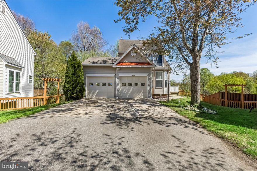 Welcome to this beautiful 3-bedroom, 3.5-bath end-unit single-family home located in the highly desirable Villas of Trentdale. This spacious home features an open floor plan and stunning hardwood floors throughout, with a charming covered front porch creating a warm and inviting entryway. The light-filled eat-in kitchen has been updated with newer countertops and stainless steel appliances—perfect for everyday living and enjoying your morning coffee—while the formal dining room is bathed in natural sunlight, offering an ideal space for entertaining. A convenient powder room completes the main level. Upstairs, the primary suite offers two separate walk-in closets and a generously sized en-suite bath, along with two additional bedrooms and a full hallway bath for comfort and privacy. The fully finished walk-out basement includes an additional full bath, providing flexible space for a recreation room, home office, or guest suite. Enjoy outdoor living on the gorgeous deck, privately framed by tall evergreen trees—perfect for relaxing or entertaining at the end of the day. The neighborhood is conveniently located close to shopping, restaurants, parks, and major commuter routes to Washington, DC, Quantico, and Fort Belvoir.