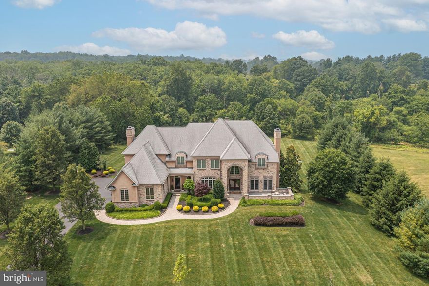 Custom built in an upscale enclave in Upper Makefield Township. Welcome to this beautifully open and thoughtfully designed home. Wonderful flow for entertaining, this home has it all! Spacious Gourmet Kitchen open to a lovely breakfast room, cozy Hearth Room and 2 story Gathering Room with stacked stone wood-burning fireplace and doors out to the bluestone terrace. A bonus flex space with walk-in closet, private Study highlighting a gas fireplace, custom built-ins and doors out to a private courtyard. The upper level offers 4 spacious bedrooms including the Main Suite with gas fireplace, sitting room, tray ceiling, 2 huge walk-in closets and dual vanity bath. The lower level is thoughtfully finished to include additional living space; billiards area, full bath, theater room, gym, bonus room and walk-out access allow this space to offer tremendous versatility. Additional amenities include beautiful cherry wood floors on the first level, custom moldings and millwork, an elevator to service all 3 levels, gorgeous lot backing to woods, outdoor fireplace and tremendous location for commuting with a short drive to the I-295 corridor and shopping and dining in downtown Newtown. Award winning Council Rock schools!