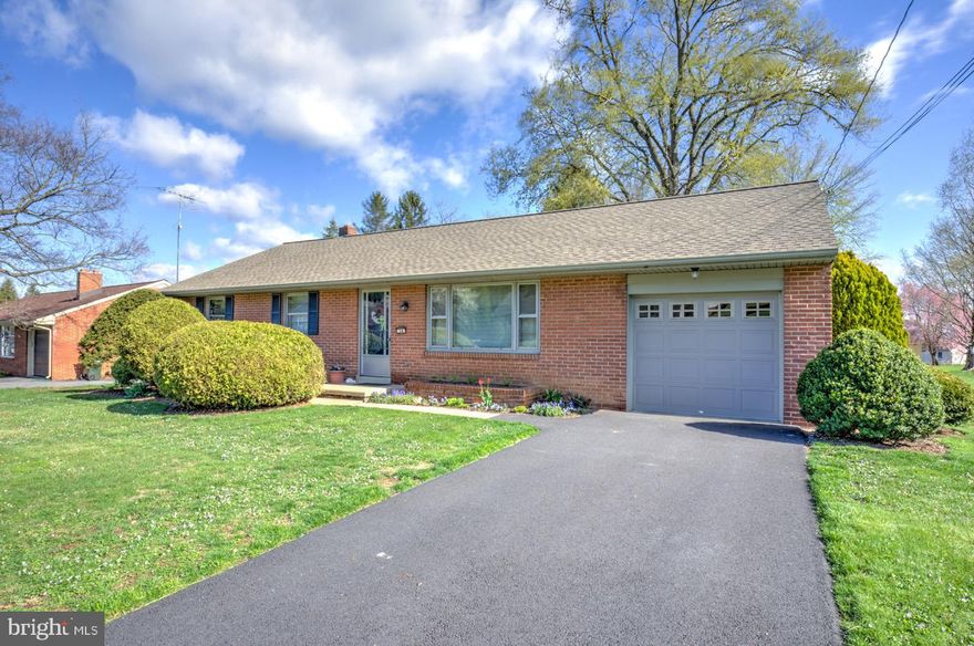 THIS PROPERTY IS GOING TO AUCTION ON THURSDAY MAY 15, 2025 @ 6:00 PM. THE LIST PRICE ONLY REFLECTS THE SUGGESTED STARTING BID. Clean brick ranch home with attached 1-car garage on .36 acre level lot. Main level offers hardwood flooring, eat-in kitchen with maple cabinetry and appliances, front living room with bay window, 3 bedrooms each with closets, and a full bathroom. Unfinished basement has an open area, central A/C, oil furnace, newer domestic water heater, updated 200-amp electric service. Small concrete rear porch; newer macadam driveway; new shingle roof in 2020. Great location!