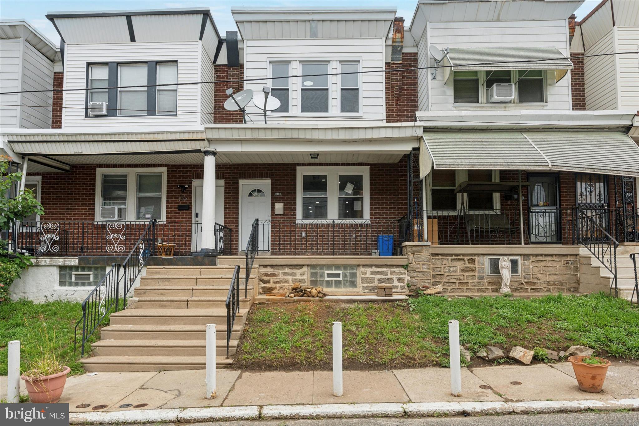 Welcome to 307 W Mentor Street, a completely renovated 3-bedroom, 2-bathroom townhome offering modern comfort in the heart of Philadelphia’s Feltonville neighborhood. From the moment you step onto the covered front porch, you’ll feel right at home. Inside, an open floor plan welcomes you with wide-plank luxury vinyl flooring and a sleek black metal stair railing that adds a contemporary touch. The living room flows seamlessly into a bright, updated kitchen featuring crisp white cabinetry, plenty of countertop space, and brand-new stainless steel appliances- perfect for everyday cooking and effortless entertaining. Upstairs, you’ll find three carpeted bedrooms with ample closet space and a modern hall bathroom with a tub-shower combo. The partially finished basement offers bonus living space and a second full bathroom, making it ideal for a home gym, office, or use for additional storage. Enjoy the privacy of your own rear yard while being just steps from neighborhood favorites like Carlo’s Grocery, Seven Brothers Supermarket, Ciddianys Coffee & Bakery, and Tierra Colombiana. With easy access to Roosevelt Boulevard, commuting to Center City or surrounding areas is a breeze. Blending style, function, and location, this home is a standout opportunity in North Philadelphia- don’t miss your chance to make it yours.