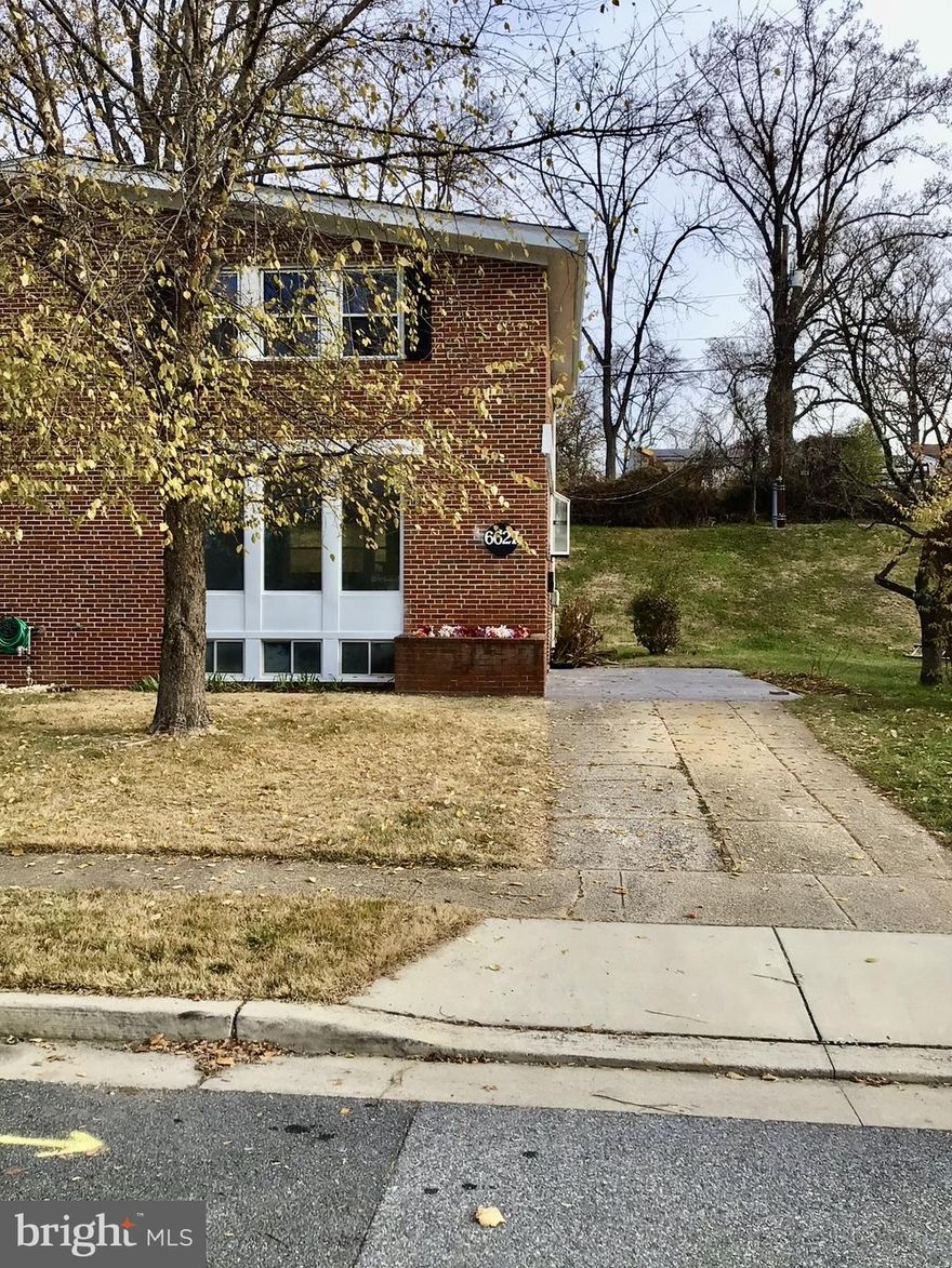 This Lovely Renovated Gem is completely Move-in Ready  !!! 3 Bedroom, 1.5  Bath,  End of Group Brick Townhouse Features include:  New Kitchen with Stainless Steel Appliances,  Beautiful Quartz Countertops, Recess Lighting, Contemporary light fixtures, New LVP Floors, New Carpet,  Open Floor Plan, New Roof,  New AC unit, Custom Accent wall, washer/dryer in as-is condition, HSA Home Warranty included per agent remarks. Finished Basement, lower level storage area, and Driveway.  (Home for the Holidays)