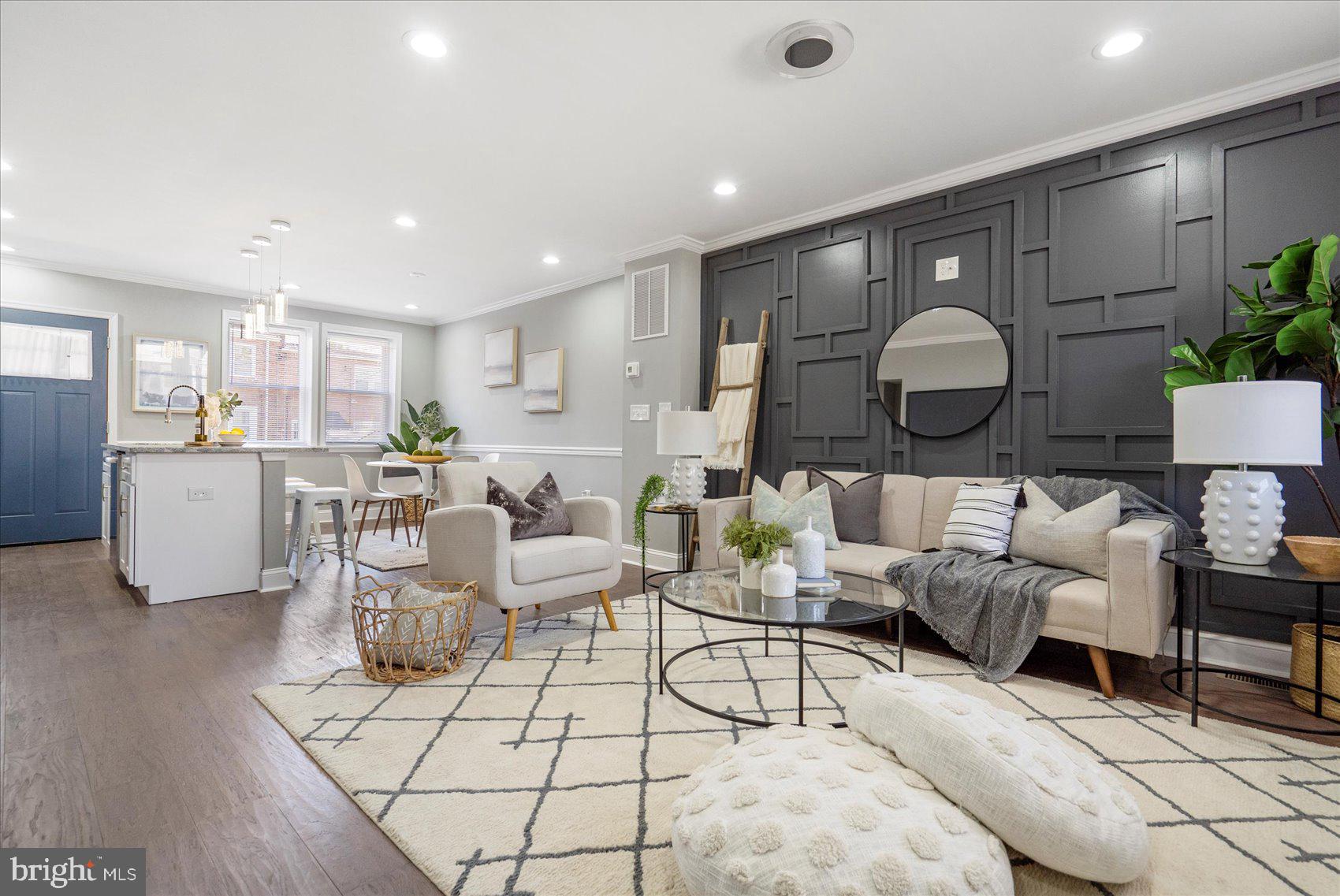 Gorgeous, newly renovated 3BR/2BA brick townhome located in a quiet neighborhood. Walk up to the covered front porch and open the door into your new home featuring an open concept main floor beaming with tons of natural light. Beautiful wide plank flooring throughout beginning in the spacious living room with a custom accent wall painted in a darker tone. A stunning kitchen awaits you with plenty of cabinets, stainless steel appliances, beautiful granite countertops with a complementing backsplash, and a large island that hosts a deep stainless sink with pendant lighting and breakfast seating. Room for a dining table makes this ideal when hosting family and friends. The second floor is newly carpeted with three bedrooms, one a spacious primary, and a newly updated full bath featuring a rainfall tile design. The lower level is finished offering additional living space, a full bath with a walk-in shower, a laundry room, storage, and a walk-out to the fenced yard. From the kitchen step outside to a yard filled with tons of possibilities. This home is move-in ready. Imagine all this and in close proximity to shopping, restaurants, and commuter routes.