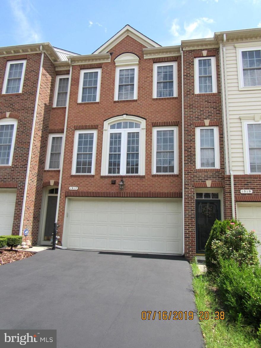 FULLY ACTIVE LISTING Welcome to the Premier Subdivision of Villages of Dorchester.  This home sparkles like new. Immaculate 3 level townhome with 2 car garage is ready for new owners.  Move in ready.  This home has been lovingly taken care of.  An 8' extension was added when built allowing the kitchen and primary bedroom to have additional space Hardwood flooring on the main level that glistens and carpet on upper and lower levels that has been cleaned. Enter the home via the asphalt driveway that leads into the 2 car garage with utility closet. Landscaping on both sides of the driveway is easy to maintain.  Door from garage enters the home on the lower level family room.  The lower level of this home is fully carpeted and quite spacious, a 1/2 bath is located there also as is the full sized washer and dryer and utility room.  New hot water heater installed 2021 that complies with AA county rules. There is a walk out level via Frenchy doors onto the paver patio.  This patio is shaded by the main level deck. There is a outside hook up for a hot tub (pre wired).  If you enter the home by the main entrance you will proceed up the stairs.  This level has hardwood flooring, fluted columns, palladium window, chair and crown molding in the living room and dining room.  Extensive windows across the front of the home allow in the naturally filtered light to come into the rooms.  There is ample seating in the living room with hook up for cable.  The dining area is adjacent to the living room and is enhanced by a beautiful chandelier.  Proceed a little further and you will find the second 1/2 bath and then enter the kitchen. This kitchen is a gourmet dream with separate island, glass front storage, breakfast bar and granite countertops.  The kitchen has 42" maple cabinetry, granite countertops, double wall oven, stainless appliances, refrigerator with water and ice on door, pantry, disposal and lots of counterspace for cooking your favorite meals.  There are recessed lights here and also in the morning room where you will find French doors leading to the Trex deck with privacy panels on each side.  The upper level features a large primary bedroom with sitting area, basket ridge, walk-in closet and a primary en suite bath. This room is carpeted and has a vaulted ceiling.  The bath has a soaking tub, separate stand up shower, two vanities and a commode room.  Lots of windows surround the sitting area of this room.  Two other carpeted bedrooms are located on this level as well as the hall bath with shower/tub combination.  This home is very close to Military Bases, Arundel Mills Shopping Center, Restaurants and BWI.   Community features a club house, outdoor pool, volley ball courts and tennis courts plus playground.  Home shows beautifully but being sold as AS IS.