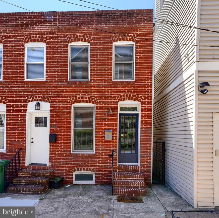 **OFFER DEADLINE  5/13 AT 8PM**--Tucked away on a quiet street in the heart of Canton, this beautifully designed light filled end of group row home is the perfect mix of historic charm and modern style. Just a short walk to the waterfront and all the lively bars, restaurants, and shops that make this neighborhood so beloved, this home is city living at its best.

Step inside to an inviting open floor plan where warm wood floors flow through the living room, dining area, and stunning custom kitchen. With crisp white cabinetry, gleaming quartz countertops, and designer finishes, the kitchen is as stylish as it is functional—perfect for entertaining or quiet evenings at home.

Upstairs, two sunny bedrooms offer cozy retreats, complemented by a well-appointed full bath. Downstairs, a beautifully finished in-law or au pair suite with its own private entrance features a full kitchen, full bathroom-- flexible living space which is ideal for guests, extended family, or even a home office.

A private rear courtyard, shared by both the main house and lower-level suite, is a charming oasis—perfect for morning coffee, dining al fresco, or unwinding under the stars.

Designed by acclaimed local designer Charleen Doverspike, this home is brimming with personality, thoughtful details, and timeless appeal. Every inch has been curated with care, making it a truly special find in one of Baltimore’s most sought-after neighborhoods.