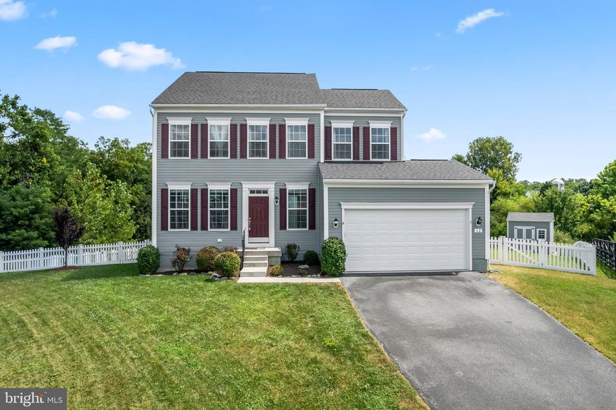 Discover this stunning 4-bedroom, 3.5-bathroom Colonial home, perfectly situated on a premium lot in the sought-after Springdale Farm neighborhood. From your doorstep, you'll be greeted by tranquil views of apple orchards, distant mountains, and a historic farm with open fields. Enjoy ultimate privacy with a stone spring house and wooded HOA land bordering your property.

Inside, the heart of the home is a spacious, open-concept kitchen and family room. The kitchen boasts an expansive island, abundant cherry cabinets, and gleaming granite countertops, offering ample space for cooking and entertaining. The family room is a bright and airy sanctuary with vaulted ceilings, large windows with custom blinds, and a cozy gas fireplace.

The main level also features a versatile sitting room, perfect for a home office or formal dining room, and a convenient powder room. A mudroom and coat closet off the garage adds to the home's practical design.
Upstairs, a large owner's suite provides a peaceful escape, complete with a double vanity, linen closet, and a tiled shower. The additional bedrooms are generously sized with large closets, and an upstairs laundry room and extra linen closets make daily routines a breeze.

The finished lower level is a fantastic bonus, featuring a huge open family room with easy-to-clean luxury vinyl plank flooring. A luxurious bathroom with a marble-tiled shower, cobblestone accents, and marble floors adds a touch of elegance. This level also includes extra storage behind the bar and in the unfinished area, plus a convenient walk-up exit to the backyard.

Step outside to your private backyard oasis. A composite deck, accessible from the kitchen, offers the perfect spot to take in the serene tree views. There is a 100 sq ft shed for extra storage. The lot backs to an HOA rain garden easement and open space, ensuring unparalleled privacy and picturesque views for years to come. This is more than a home; it's a lifestyle. Recent updates include * Fresh Paint 2025 * Upgraded HVAC duct work * Newer Carpet * Professionally manicured landscaping.*