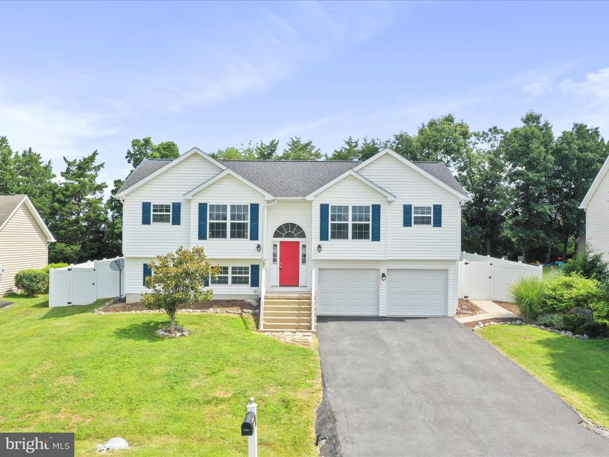 Beautifully updated 5-bedroom, 3 full bath home in the desirable Spring Hill community of Inwood, WV. The upstairs features an open concept living room, kitchen with ample storage, dining area, primary bedroom with en-suite bath, plus two additional bedrooms and a full bath. The lower level offers two more spacious bedrooms, a third full bath, and laundry room. Freshly painted with new flooring throughout, plus recent major updates including a new roof, HVAC, garage doors, and fencing. Enjoy a fully fenced backyard perfect for entertaining or pets. Conveniently located minutes from I-81, shopping, and schools. Move-in ready—schedule your showing today!