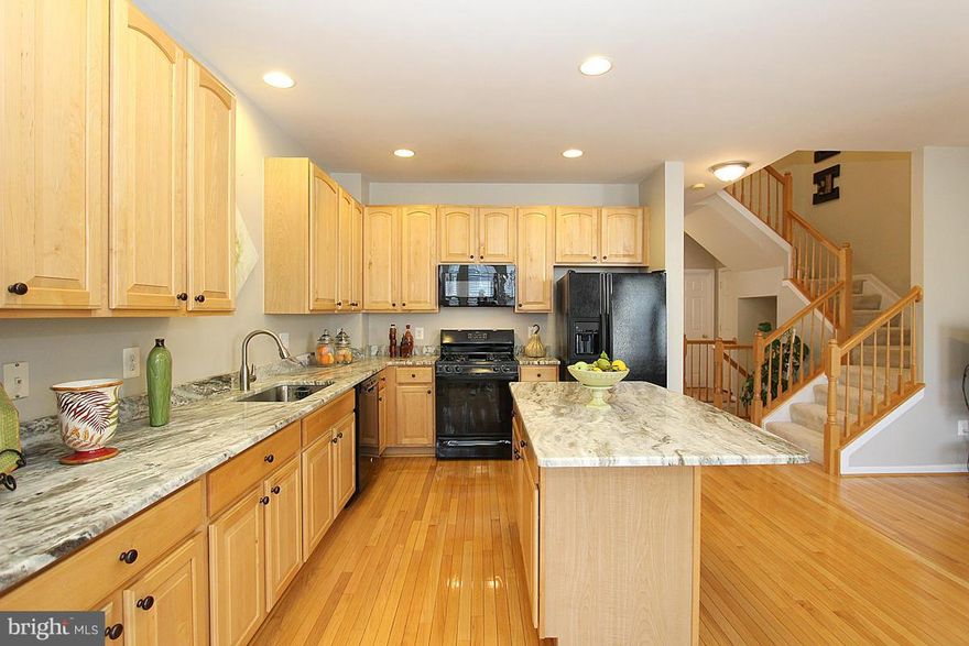 Country Club Living Just Steps to Trump Golf Club. Upgrades Galore +3 level Bump Out. Seller offers long list of Brand New improvements N upgrades,includes the latest in upgraded Stone granite counters w enlarged Center island. Both Baths w Brand New Vanity counters, sinks , faucets  mirrors, NEW HVAC, paint n lighting throughout. LRG Deck off kitch +Patio off LL .LRG portion of roof new. A must c