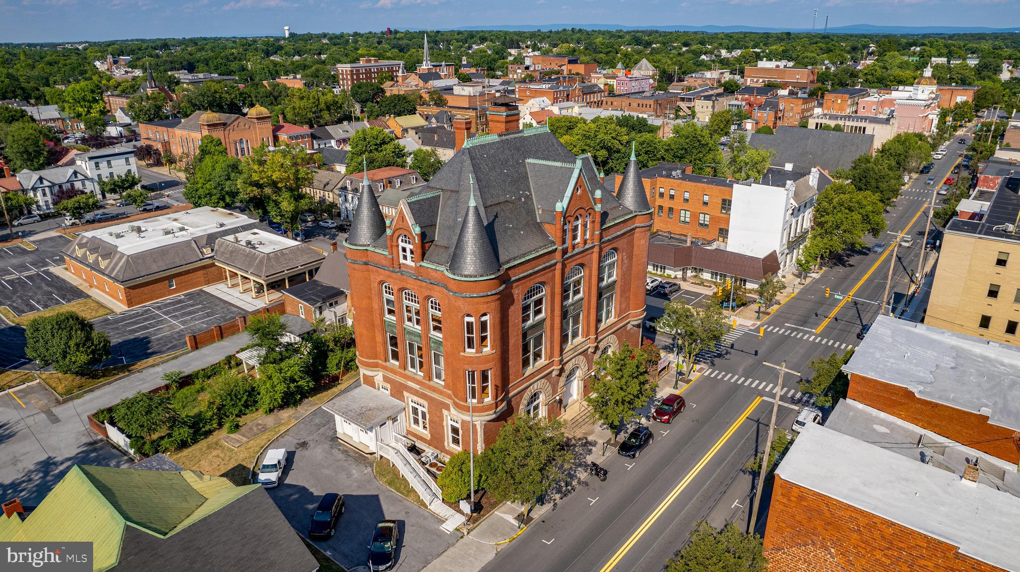 Presenting an extraordinary opportunity to acquire a prestigious landmark building in the heart of downtown Martinsburg. This prime commercial property exudes grandeur and sophistication, embodying the essence of timeless elegance. Constructed in 1895, this magnificent four-story structure boasts a full basement and encompasses an expansive 13,000 square feet.
Upon entering, one is immediately captivated by the enchanting ambiance, heightened by the antique elevator, soaring ceilings, and meticulously refinished maple hardwood floors. The tastefully adorned interior is adorned with fresh paint, while the opulent marble staircase and graceful revolving door add a touch of regality.
This architectural masterpiece has been carefully designed to accommodate the most discerning of needs. Embracing versatility, the property features an enchanting grand ballroom, five luxurious multi-stall bathrooms, and three meticulously crafted granite-surrounded fireplaces. With fifteen thoughtfully designed offices and ADA accessibility throughout, this property effortlessly blends historic charm with contemporary functionality.
Enhancing the allure of this remarkable offering, the property proudly played host to the filming of the esteemed series, "The Men Who Built America." Furthermore, its historical significance renders it eligible for coveted Opportunity Zone financing and valuable State and Federal Tax credits.
Unleash your imagination and unlock the limitless potential of this extraordinary property. The future of this unparalleled gem could encompass a myriad of possibilities - from a boutique hotel that caters to the most discerning clientele, to an exquisite wedding/event venue that creates unforgettable memories. Alternatively, envision a fine restaurant seamlessly integrated with luxurious Airbnb accommodations, or any other endeavor that stirs your passions.
Remarkably, this exceptional opportunity is available for under $85 per square foot, representing an exceptional investment proposition. Adding to its allure, the City of Martinsburg offers a B&O tax deferment program, further enhancing the financial benefits. Discover the potential of this unparalleled offering and seize the chance to own a piece of history, with the possibility of additional perks awaiting your discerning eye.