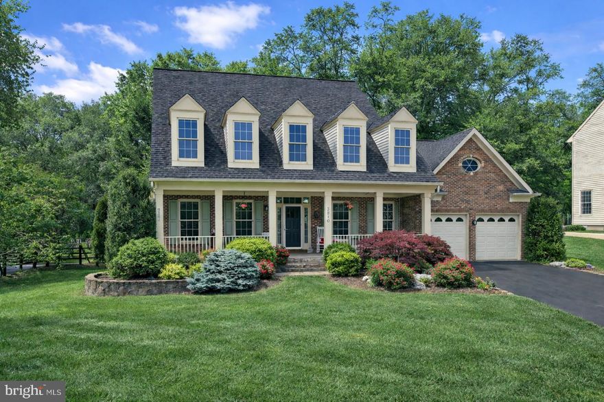 Welcome to 3910 Arbor Crest Way, a classic center-hall colonial set on a .38-acre lot in the desirable Smalls Nursery community. This picturesque brick-front home offers 5,574 total square feet across three finished levels, with 4 bedrooms (including a main-level suite), 4 full bathrooms, a powder room, and a lower-level bonus room—ideal for guests.
 Meticulously maintained and thoughtfully updated, the home features a substantial 2022 main-level renovation that removed walls to create an open, flowing layout between the main living areas and the kitchen. Highlights of the 2022 remodel include a new gourmet kitchen, a new gas fireplace and shiplap accents in the family room, renovated main-level bathrooms, refinished oak hardwood floors, fresh interior paint, a reconfigured mudroom/garage entry, and designer-selected contemporary lighting throughout for a cohesive, elevated look.
 Step inside to bright, open spaces anchored by a two-story foyer, 12’ ceilings, gleaming hardwood floors and staircase, recessed lighting, extra-wide crown molding, and abundant windows that flood the home with natural light. The new designer kitchen features Caesarstone Airy Concrete countertops, Jenn-Air stainless steel appliances, a 6-burner gas range with grill and hood, soft-close white cabinetry, a wine refrigerator, subway tile backsplash, a deep farmhouse sink, and a large Calacatta Supreme Emerstone–topped island with breakfast bar, and a sunny breakfast area framed by windows. The kitchen flows into the adjoining family room, which offers a gas fireplace set in a striking black shiplap accent wall and a walkout to the patio and backyard. A cozy living/sitting area connects seamlessly to the family room, creating flexible gathering spaces.
 The main-level primary suite includes a spacious bedroom with sitting area and two walk-in closets with Elfa organizers. The spa-like bath offers heated floors and towel racks, a glass-enclosed shower with subway tile, a dual vanity with an MSI Calacatta Trevi quartz top, a large linen closet, recessed lighting, and high-end tile finishes and hardware.
 One of the home’s standout features is the private, fully fenced backyard retreat: an extensive flagstone patio with an exterior stone fireplace, built-in eating area with bar seating, and a grill with a hardline gas connection—perfect for relaxing or entertaining. All backyard patio furniture and equipment convey. A formal dining room, office with built-in bookshelves, powder room, and laundry room/mudroom complete the main level.
 The newly carpeted (2026) upper level offers three bedrooms and two full bathrooms, including one bedroom with an attached bath. All bedroom closets feature built-in organizers, and dormer windows -  adding charm and character throughout.
 The expansive walk-up lower level is designed for fun and function, featuring a full bar and ample space for a large recreation room, exercise area, and game area, plus a full bathroom and a bonus room with an attached bath and closet—ideal as a guest suite. Two oversized storage rooms provide exceptional utility with shelving and a convenient utility sink with hot and cold water.
 Ideally located with easy access to dining, shopping, entertainment, and major commuter routes, this home is also close to parks, recreation facilities, and golf courses—perfect for outdoor enthusiasts. Top-rated Montgomery County schools further enhance the appeal. This exceptional property offers a rare opportunity to own a luxurious home in a truly coveted neighborhood.