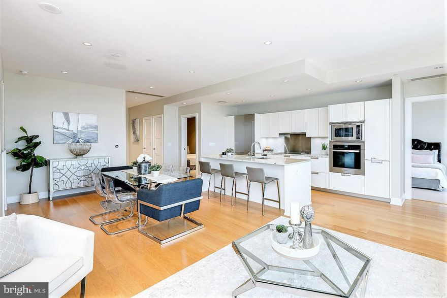 THE VIEW BELONGS TO YOU - Enjoy breathtaking panoramic skyline views from this three bedroom, three and a half bath residence in the sky. Perfectly situated in the center of it all, this residence is steps away from fine dining, one-of-a kind shopping, world-renowned cultural destinations, and exciting nightlife.