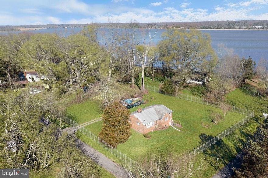 Motivated Seller! Send your best offer. The Beach Front Bargain Hunt Ends Here! The bargain just got better!! The Opening price just got better!!

The home sits on six lots, totaling .55 acres, providing ample space for outdoor activities and future expansion. Have you been yearning for a weekend family getaway or looking for a home where every day feels like a vacation? Your search ends today with Cedar Haven!

Architecturally and virtually staged to enhance the possibilities. Design this home the way you want.

Cedar Haven was established in 1927 as a planned and private beach community on the Patuxent River. The same family has cherished this timeless home for three generations, and now it's your turn to invest in it for generations to come.

Every Morning, wake up to breathtaking views of the Patuxent River. This classic single-family, four-sided brick home has a garage and an enclosed porch. Just at the block's end, enjoy your private beach's serenity and exclusivity.

A Convenient Location close to everything! Andrews Air Force Base is a 40-minute drive, Alexandria is a 49-minute drive, Washington, D.C. is a 53-minute drive, and National Airport is a 57-minute drive.

This quiet, yet-to-be-discovered community is perfect for a staycation, a short-term rental investment, or a weekend getaway. With everything within an hour's drive, you get the best of both worlds—peaceful living with city convenience.

Stop looking and start living the beachfront dream today! Contact us now to schedule a viewing and make Cedar Haven your new family legacy.