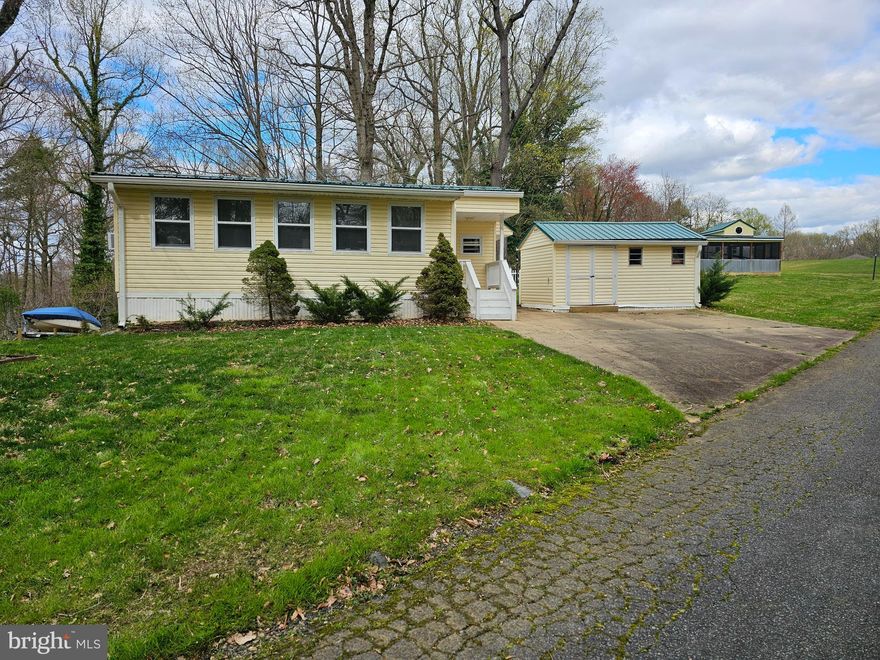 This property located in Indian Acres Campground is waiting for you. Limited to 150 days a year no more than 100 consecutive days (not a full time residence). This move in ready  property has a large garage with work bench as well as a large shed. Bring the family and come to see all this property and community have to offer. Plenty of activities as well as swimming pools, fishing, boating, beach, dock, party room, convenience store, and much more. A great get away and I'm happy to show the way!