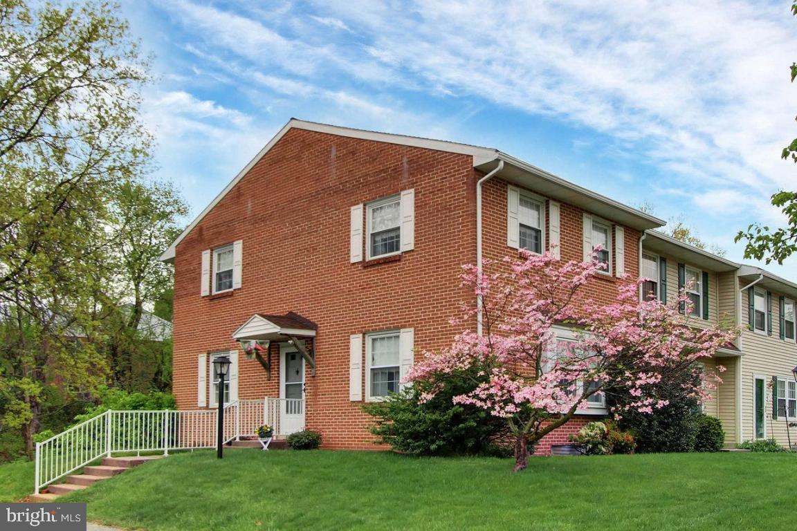 Enjoy carefree living in this all brick end unit conveniently located to I-83,shopping,restaurants & schools.This 3 BR,2.5 bath home has over 1700 sq ft of living space.Features include a finished walk-out lower level,ensuite master,eat-in kitchen,all appliances included,private rear patio overlooking tranquil stream and more.Condo fee includes water,sewer,trash,exterior maintenance,lawn care,snow removal,community center & pool.Priced to sell!