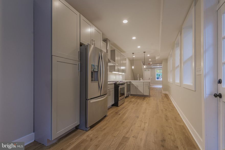 Stunningly modernized 4 BR 4 FBA Upper Fells Point home w/ a 10 YR CHAP Tax  Credit boasting engineered hardwoods through-out, lavish kitchen w/ quartz counters & ss appliances. 2nd level features 2 BRs, 2FBA w/ primary bedroom walk-in closet & bath w/ dual vanities and massive walk-in shower. 3rd Fl BR w/FB an another massive walk-in shower w/ walkout to relax on your 14x16 roof deck.  FF LL w/ 8 ft ceilings offers a rec room/den/possible 4th BR w/ full bath that provides additional living space and the must have home office!