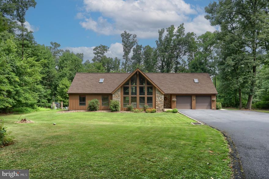 Fabulous Private Estate on 17 Acres only 10 minutes from Hershey.  This custom built one owner home has been lovingly updated and well maintained and boasts over 4,000 finished square feet including the basement. Other amenities include an oversized 2 car attached garage and an additional oversized 3 car detached garage with a 2nd floor ideal for the car enthusiast, crafts, woodworking, or just having a place for your toys. You'll love  the open floor plan on the first floor with a Great Room featuring a floor to ceiling stone fireplace, natural wood vaulted ceiling, antique chestnut flooring, and an abundance of natural light. If you love family gatherings or entertaining friends, you'll feel right at home  in the spacious eat in kitchen with the expansive island,  SS appliances, a separate beverage cooler,  luxury vinyl plank flooring, tile backsplash, unique granite countertops sealed with vinyl leather, double oven, large walk in pantry,  and plenty of room for a large table. Or take the party outside to the 2 tier private composite deck already wired for a hot tub. Did we mention privacy?  Enjoy this secluded sanctuary with your morning coffee or evening beverage as you take in the sounds of nature all around you. The second floor is a very generous space with a large loft overlooking the great room and the foyer, the primary bedroom suite with a unique updated bath, walk in ceramic tile shower, and walk in closet. At the other end of the loft area there are 2 bedrooms, an office, and another full bath. The finished lower level is an added bonus featuring a family room with new LVP flooring and wet bar, another bedroom, and storage room. There are multiple heating systems including an outside furnace to take advantage of your own source of wood from the property. Outside you'll find hiking and ATV trails around the property for family enjoyment.  Don't wait to schedule a showing to see all this property has to offer.