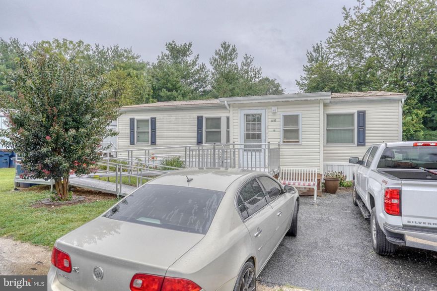 Well cared for 3-bedroom, 2-bath doublewide on a nice, landscaped lot. 2 additions provide extra living space as well. New Anderson Windows, New Flooring, Updated Bathrooms, New Roof, and much more.  Don't let this one get away. Schedule your tour today. The sale has been approved by the park; the buyer must be approved. Current Lot Rent is $580, including discount