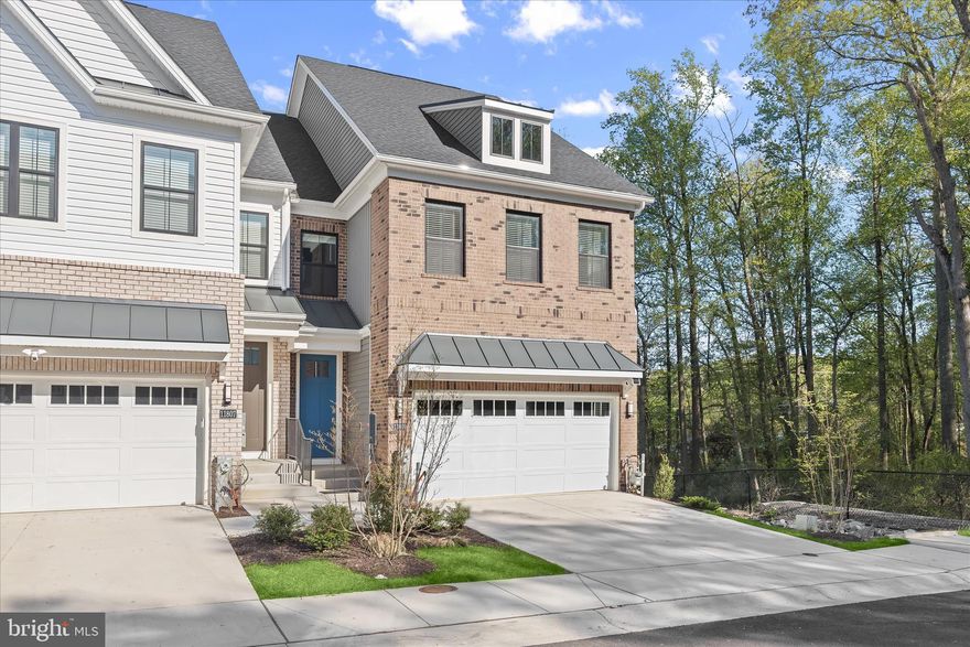 Welcome to 11809 Summer Woods Place in Marriottsville’s hottest new community - Chapelgate Woods. Built in 2024, this like-new end-of-group 4-level townhome is loaded with premium upgrades and completely move-in ready. Enjoy striking wide-plank LVP flooring and a neutral color palette throughout the open-concept main level. The on-trend kitchen feels bright and airy with white shaker-style cabinetry, stainless steel appliances, a double oven, five-burner cooktop, and quartz countertops. The deck off the living room provides the perfect place for morning coffee or evening cocktails. A coat closet, pantry, and half-bath complete the main level. 

Upstairs your sprawling primary suite awaits - tastefully finished with crown molding, recessed lighting, an expansive walk-in closet, and double-door entry. The spa-like primary bath boasts a dual sink vanity, quartz countertops and a large shower stall. Two additional bedrooms with substantial closets, a shared bath, linen closet and laundry room complete this level. Discover a sizable loft on the upper level which serves as the perfect recreation room, home office, or theater room. You’ll also find a half-bath on this level and access to the spacious rooftop terrace. A bonus recreation room fills the lower level along with another full bath and two ample storage areas. With easy access to all major Baltimore/DC commuter routes and located within walking distance of the many popular shops and restaurants at Turf Valley Town Square, the location and condition of this like-new townhome simply can’t be beat.