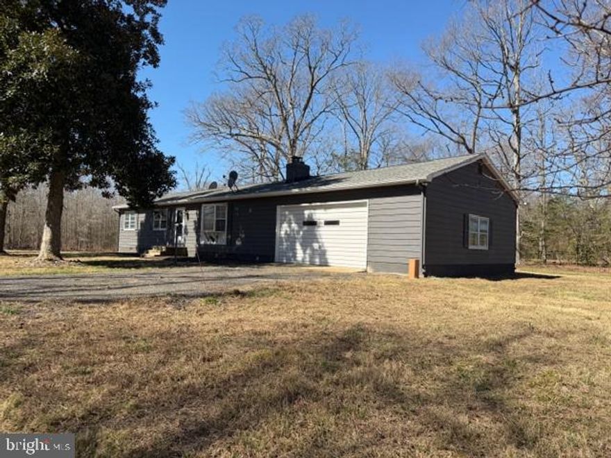 Rambler on .85 Acres with Two Garages and Screened Porch!
Located in Hollywood, MD, this  rambler offers 1,248 square feet of living space on a .85-acre lot and privacy. The home features an open living, dining, and kitchen layout designed for comfortable everyday living and easy entertaining.
The kitchen includes a large center island that provides additional workspace, seating, and storage. The living room is centered around a brick fireplace with a wood stove,  a focal point for the main living area. 
The home offers three bedrooms and two full updated bathrooms. Just off the living space, a screened porch provides a great place to relax and enjoy the outdoors while overlooking the spacious yard.
Additional features include an attached two-car garage and a detached one-car garage/workshop, offering plenty of space for vehicles, storage, or projects. LVP flooring throughout and ductless mini split.  Roof is less than 5 years old. 
The property provides room for outdoor activities while still being conveniently located near shopping, dining, and amenities in the Hollywood area along with state parks and county boat ramps  nearby.