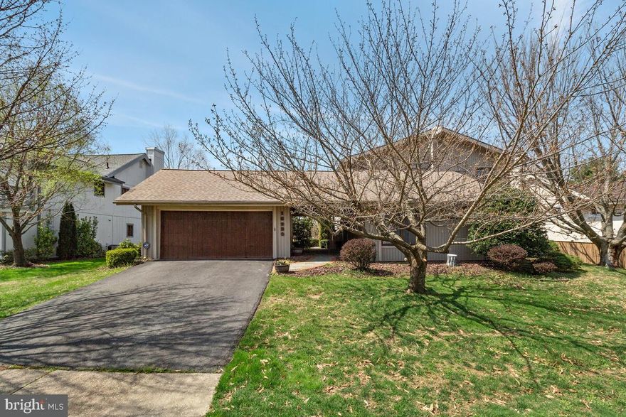 Absolutely adorable contemporary home! Wide open spaces with incredible detail around every corner. Cathedral ceilings in living room add to the light and airy feel inside this home. Floor-to-ceiling built-ins in living room are perfect for you to display all of your personal touches. Kitchen opens to large living area with wet bar, perfect for entertaining! Sliding glass doors lead you out to spacious deck overlooking lush private lot with flowering trees. Large two car garage with breezeway into house to protect you from the elements! The perfect commuter location, the perfect house, everything you have been looking for. You don't want to miss it!