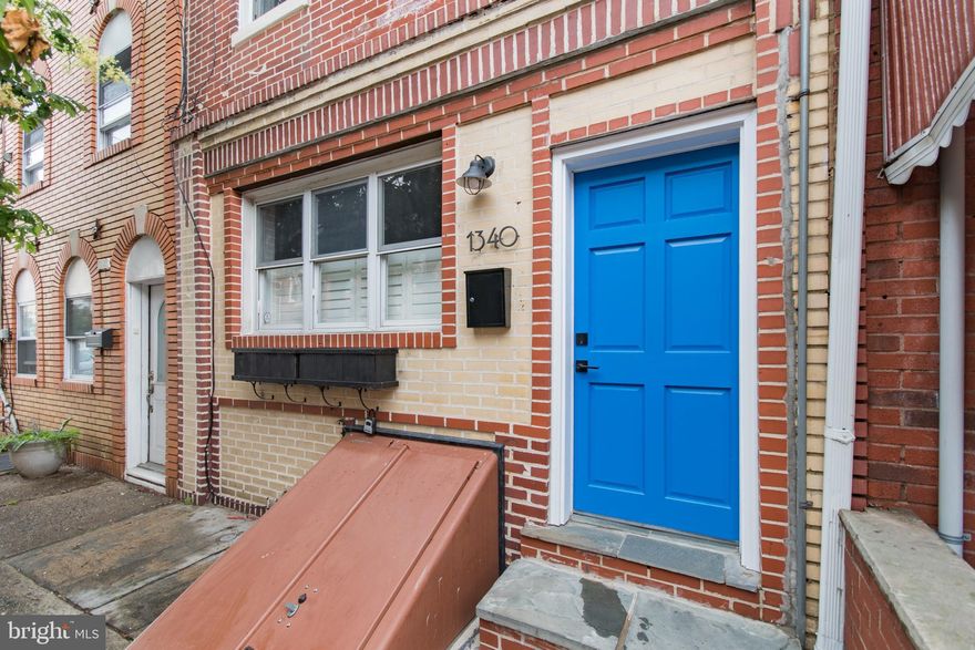 This gorgeous 3 bedroom 2 bathroom home in the heart of Passyunk Square can be yours if you act fast, as this property won’t be available for long!  Open the cobalt door of 1340 E Passyunk and youre greeted by the sunny and spacious open plan living and dining area, with windows that peer onto the tree lined street and bring in lots of beautiful sunlight. Walk towards the back of the first floor and you’ll find the kitchen- complete with stainless steel appliances, subway tile backsplash, a farmhouse sink, quartz countertops, and a kitchen island with seating for two. The back door opens up to the paved backyard patio and the second door in the kitchen will lead you down to the partially finished basement which is perfect for storage.  Up the stairs to the second floor you’ll find two of the home’s three bedrooms- both with ample closet space- and the first full bathroom with a double sink vanity and shower tub combo. Also on the second floor is an extra-large walk-in closet that could potentially be converted to a laundry room.  The third floor is home to the massive sun drenched master suite- complete with a stunning stand-up shower, and roof deck access.  Located in charming and historic Passyunk Square- youre steps away from some of the most incredible dining options Philly has to offer and an abundance of green space with Capitolo Park only a half block away. The home is also conveniently within walking distance of stores such as Acme and CVS and half a mile east of the BSL.  Schedule your showing today!