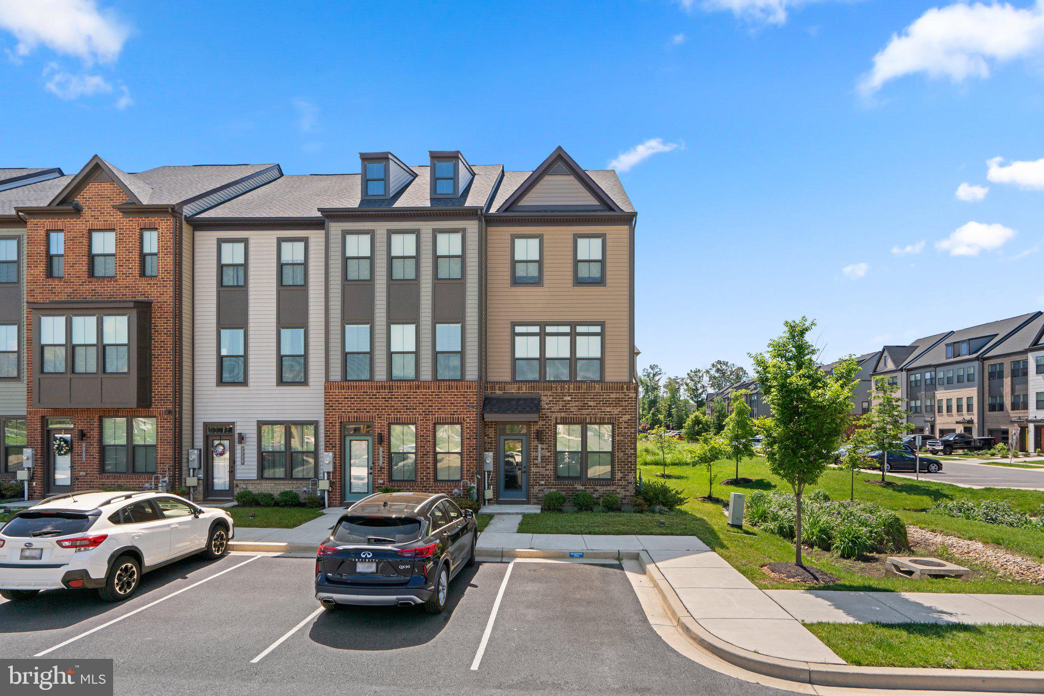 Available for immediate occupancy! Constructed in 2020, this end-unit townhouse beautifully blends contemporary design with natural surroundings. On the entry level, you will discover a generous guest bedroom with an attached full bath, leading to a recreation room that opens to the backyard. The main level features a modern kitchen with granite countertops, hardwood floors, and stainless steel appliances, seamlessly connected to the family room and dining area with a sunny deck perfect for grilling and relaxing. The top floor boasts a primary bedroom with a spacious walk-in closet and an en-suite bathroom. Additionally, there is a second bedroom with its own full bath, and a dedicated laundry area, making the top floor both practical and comfortable. This home has a convenient assigned parking space in front of the entry and sits directly across from a play area, skate park and dog walking space. Experience modern living at Tanyard Shores, where unique amenities seamlessly integrate indoor and outdoor spaces, offering a balanced lifestyle. Nestled along Marley Creek, the new community center serves as the heart of Tanyard Shores. Designed to promote healthy living, the development features interactive walking and bike trails that wind through the community, converging at the community center, creating a vibrant and cohesive environment.