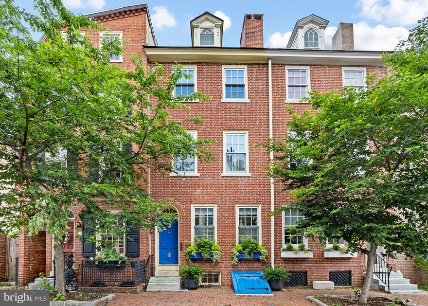 Welcome to 241 Delancey Place! This grand, fully renovated Joseph Wetherill House (c. 1800–1810) is a piece of Philadelphia history located on one of the city’s most picturesque cobblestone streets. 4-bedrooms, 2.5-baths span across 4 levels of living, combining timeless historic charm with the comfort and convenience of modern upgrades.

Enjoy the rare luxury of gated, deeded parking accessible through a serene English garden—your private oasis in the heart of the city.

Inside, you'll find a stunning blend of architectural character and thoughtful renovation, including 6 fireplaces, soaring ceilings, exposed brick, and a unique layout that offers both style and function. The home features upgraded electrical, plumbing, windows, and doors, all while preserving irreplaceable details like appraised Robert Wellford mantelpieces

The sun-drenched chef’s kitchen is the heart of the home, complete with Sub-Zero refrigerator, dual ovens, a warming drawer, skylights, and a breakfast room with garden views. A spacious formal dining room and covieniently located powder room round out the main level.

Retreat to the second-floor primary suite, complete with a gas fireplace, custom outfitted closets and an en-suite bathroom with heated marble floors, seamless glass-enclosed shower and a clawfoot soaking tub. The third floor features two bedrooms with a Jack-and-Jill bath, each with its own fireplace. The front bedroom offers charming views over Delancey.

The fourth floor can serve as a large bedroom or flexible family/media room, with generous closet space. The finished lower level includes a bonus space for a home gym, office or entertainment area, plus storage and laundry.

Located just blocks from Headhouse Square, award-winning restaurants, Three Bears Park, and more, this home is proudly listed on the Philadelphia Historic Register. A 4-year tax abatement remains in place.