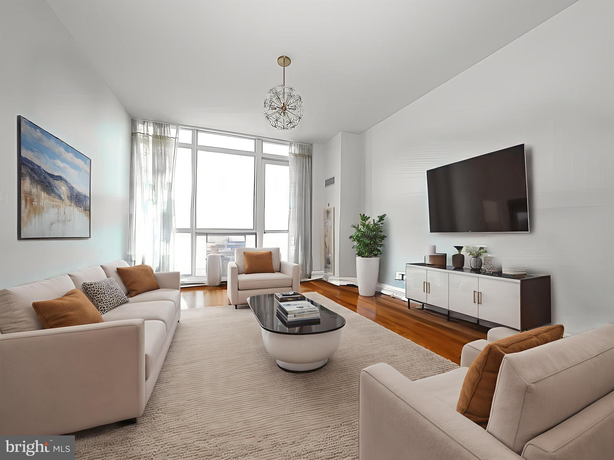 Perched on the 20th floor of the Reef building in the exclusive gated Waterfront Square Condominium community, this luxurious 2-bedroom, 2.5-bath residence offers panoramic views of the Delaware River and Northern Liberties skyline along with 1 car garage parking! Watch sailboats glide by and sunsets paint the sky from your private balcony, all while enjoying a serene, landscaped setting where turtles, geese, and even foxes occasionally wander.
This spacious, light-filled unit features an open-concept layout with floor-to-ceiling windows and gleaming hardwood floors throughout the main living areas. The gourmet kitchen is a chef’s dream with premium quartz countertops, Shaker-style cabinetry, stainless steel appliances, and a large seated island perfect for entertaining. The oversized primary suite easily accommodates a California king bed with room to spare for nightstands, a dresser, and a sitting area. A newly outfitted California Closet walk-in closet is a standout, and the spa-inspired en-suite bath features a soaking tub, glass-enclosed shower, and double vanity with granite countertops. The generously sized guest bedroom also enjoys sweeping river views and its own full bath. A stylish powder room is conveniently located near the entry. There is also a walk in laundry room with a full-sized washer and dryer with additional storage.
Waterfront Square is a premier gated community located along the Delaware River in Northern Liberties. Residents enjoy world-class amenities including 24-hour concierge service, round-the-clock security, maintenance, and convenient mail pickup and drop-off. The community boasts a fully equipped fitness center and a 25-meter Jr. Olympic-sized indoor pool—one of the only regulation lap pools available in a Center City condo. After a swim, unwind in the Jacuzzi, steam room, or sauna. Outside, the riverfront sun deck offers BBQ grills and spectacular panoramic views of the water and bridge—perfect for summer entertaining. A complimentary resident shuttle provides round-trip service to Center City and 30th Street Station. EV charging stations are also available onsite.
Just across the street is the vibrant Northern Liberties neighborhood—“NoLibs”—renowned for its dynamic food and drink scene. Stroll along 2nd Street to discover some of the city’s best restaurants, lively beer halls, coffee shops, and entertainment venues.To the south, explore Race Street Pier, Cherry Street Pier, and Penn’s Landing, offering everything from outdoor dining and waterfront bars to ice skating, roller skating, and paddle boating. To the north, Rivers Casino offers dining and entertainment just steps away. The Delaware River Trail, right outside your door, connects Waterfront Square to Penn’s Landing and Penn Treaty Park, offering a beautifully landscaped path for walking, running, or biking along the river.