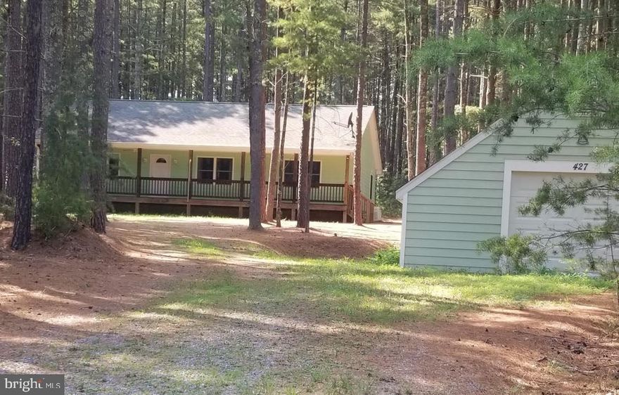 Very Nice Setting in Pine Trees.  Only 25 miles from Winchester, VA .  This Private Subdivision has their own little Lake with Boating and Catch & Release Fishing.  3 Bedroom House with Porch and Deck plus a Detached Garage on 3 Acres.  Plus a Nice Bunkhouse.  Full Capacity Propane Generator all set for if the Power Fails.  Come See This Beauty!