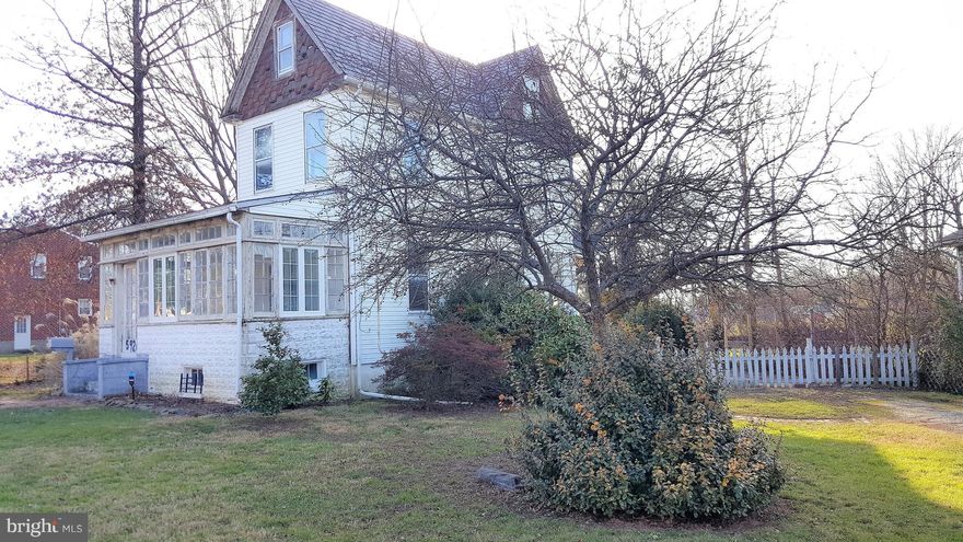 Oversized lot with driveway to 3-bed/2-bath detached home in need of restoration.  Main level offers enclosed front porch, sun room/library, side entry foyer with full bath, dining room and large eat-in country kitchen.  3 bedrooms and full bath on upper level. Walk-up stairway to large floored attic space.  Full unfinished basement includes additional storage space, flush, and plenty of room to grow.  New oil boiler was just installed.  Covered back porch overlooks enormous fenced back yard.  This home needs renovation and is being sold As-Is.