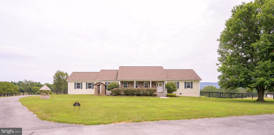 Built by a reputable builder on lovely 2-acre lot with mountain views, this 3-bedroom, 2 baths one-level home, with covered front porch and a wooden swing, on a quiet street is ideally located to both Route 9 and Route 340.  Cozy family room with the fireplace and shelves leads to a new back deck, large kitchen with modern appliances, separate dining room, and huge formal living room.  Unfinished lower level with walkout offers plenty of storage space. Easy to care carpeting throughout. Back deck provides fabulous option for outdoor leisure with panoramic mountain views in a small community.   Newer high-quality roof (architectural shingles), fenced back yard.  Home Warranty Plan is provided.  Great commuter location: 2 minutes to Rt.9 and 4 minutes to Rt. 340. Comfortable living!