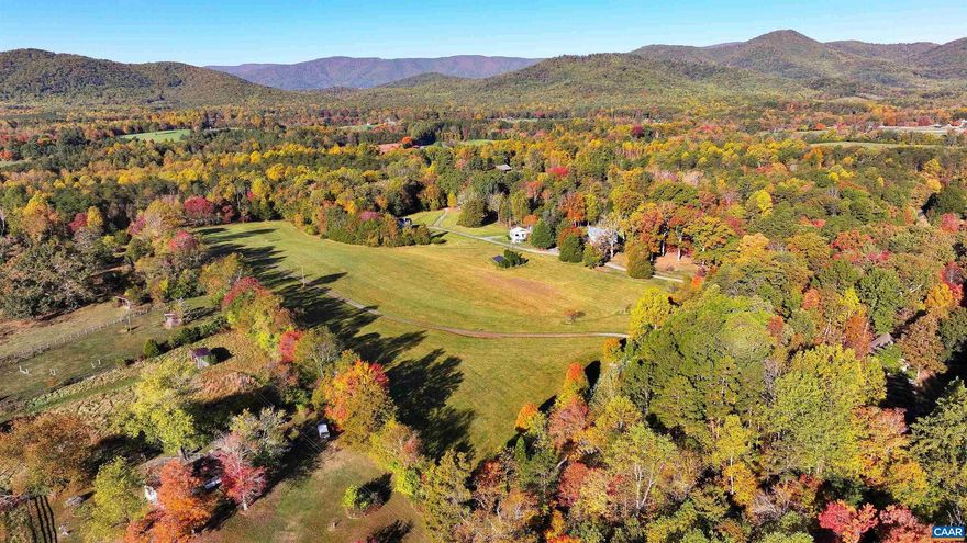 A BUY OF A LIFETIME IN THE HEART OF HUNT COUNTRY! Timeless 1916 Virginia farmhouse blends classic styling & modern convenience on 55+ acres in beloved Free Union! Leave the world behind & bask in privacy, picturesque views, & impressive income potential within 20 minutes of Charlottesville. Delight in the cozy & quiet elegance of generously-sized rooms, a versatile floor plan offering one-level living, a workhorse farm kitchen, and a glorious great room for gatherings or quietude. With four bedrooms, a home office, & three full baths, there's plenty of space for everyone. Move-in ready w/potential for future updates and expansion. Accommodate guests, renters, or multigenerational living in the 2 additional cottages. Enjoy endless possibilities w/ no conservation easement & division rights! Embrace off-grid living options w/  solar, whole house generator, wood stoves, & a well hand pump. Bring your horses, creative, conservation & gardening pursuits! Don't miss this extraordinary opportunity to live in harmony with nature in the best of Albemarle!,Wood Cabinets,Fireplace in Bedroom,Fireplace in Great Room,Fireplace in Home Office,Fireplace in Living Room