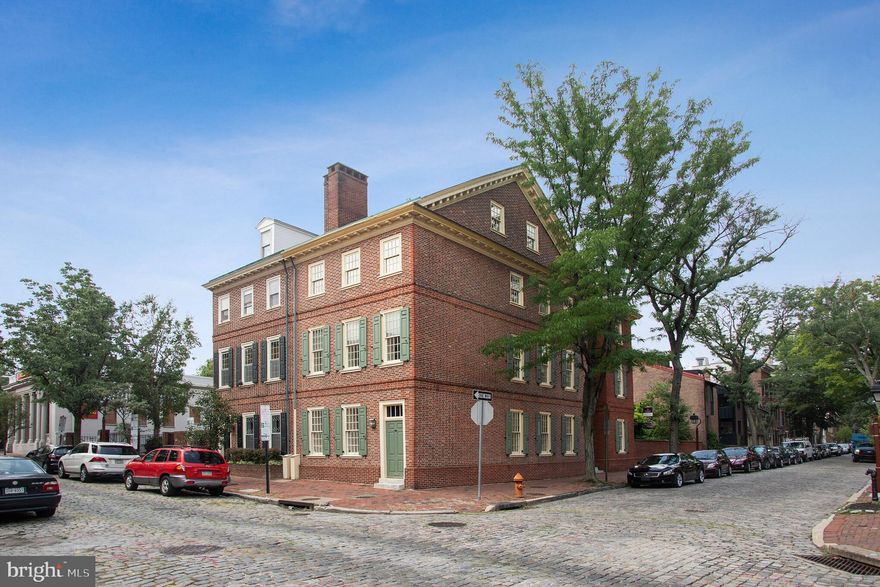 A historical masterpiece, dating back to 1780, that has been restored to 21st century perfection. Enter the home and you will be greeted with a dramatic sweeping staircase in the center hallway. To the right is a bright modern eat-in kitchen with custom cherrywood cabinetry, granite countertops, Wolf and Sub-Zero appliances and a heated floor. Pass through the French doors to a very lush, walled garden complete with an irrigation system. There is an eating area under a pergola, a wrought iron gate and a picturesque brick garden shed. The first floor also has a spacious dining room and living room with a fireplace, one of three in the house and a powder room. On the 2nd level is the first of two master bedroom suites with a private bath, spacious closets and another marble fireplace. On this floor you'll also find a garden view bedroom with a private bathroom, and the large laundry room. The third level takes you to the bilevel master bedroom with two large walk-in closets with a laundry chute, and a luxurious bathroom with a large shower room and free-standing claw foot tub. Above the master bedroom is an exercise/media loft with a wet bar that leads out to a large deck with views of St Peter's Church, Society Hill and the Philadelphia skyline. A great office/sitting space is outside of this master bedroom along with a 4th full bathroom. A bonus den/play room has been added to the basement. Other features include dual-zoned heating and air conditioning, radiant-heated bathroom and kitchen floors, 10 foot ceilings, interior and exterior shutters, large sunny windows (most have been updated) in every room and exposure on 3 sides of the home. The entire home went through a major renovation in 2006 including an update of all systems & mechanicals, electric and plumbing. A short walk away are the Head House Square Market, which has farmers and craft markets on weekends, and Penn's Landing, offering spectacular river views. Majestic homes such as this do not come on the market often so call now for a private showing.