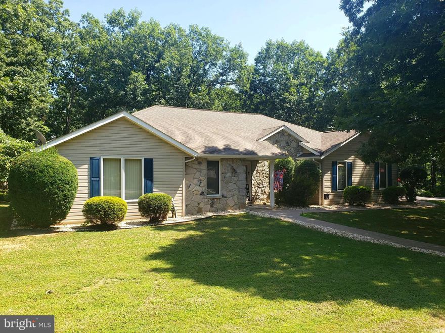 Here is your opportunity to own a Ranch-style house in Lakewood. The main level boast hand scraped acacia hard wood floors,  vaulted ceiling in the living room with fireplace, large open spaced kitchen that walks out onto a wrap around composite deck. There are also 3 bedrooms and 2 full baths on main level. The lower level is completely finished and has 2 to 3 extra bedroom spaces and a full bath. Rooms could also be used as an office, media room, exercise area and more. The home sits at the end of a cul-de-sac and offers plenty of parking. There is a concrete patio that hosts a luxury hot tub area. There are too many features to list all of them. Make your appointment and come see this home while it last.