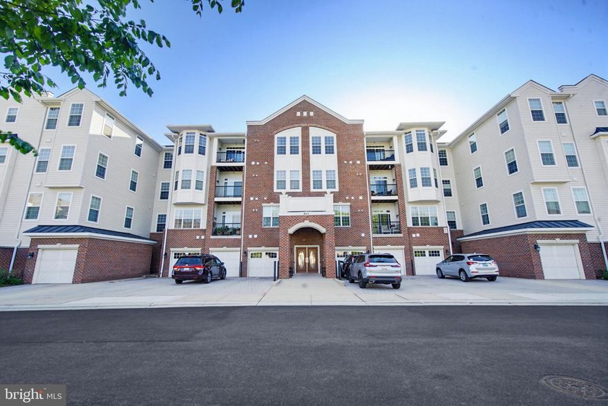 Welcome to 8511 Coltrane Court, Unit 204 — a sunny, beautifully updated 2 bedroom, 2 full bathroom condo in the highly sought-after Gatherings at Ellicott Mills 55+ community. This move-in-ready home combines modern comfort with timeless design. Enter into a bright and open layout, where an abundance of natural light fills every room. The home has been updated with brand new waterproof luxury vinyl plank throughout, creating a warm and inviting atmosphere. The beautifully upgraded gourmet kitchen features stainless steel appliances, tile backsplash, and granite countertops. Just off the kitchen, a functional dining room provides the ideal space for meals and gatherings. Retreat to the spacious, sun-filled primary bedroom suite, complete with a large walk-in closet, a second closet for additional storage, and a beautifully appointed en-suite bathroom featuring dual sinks, a roman shower, and a linen closet — your own private spa-like escape. A well-sized second bedroom and an additional full bathroom provide plenty of space for guests, family, or a home office. Step out onto your private balcony and take in the peaceful views. To top it all off, enjoy the convenience of in-unit laundry and direct building interior access to your private enclosed garage — keeping you comfortable and dry year-round. Beyond the unit itself, this amenity-filled community truly has it all. Arrive home each day through a spacious and welcoming lobby, and take advantage of the elevator building for easy access. Enjoy the clubhouse, outdoor pool, fitness center, game room, and beautifully landscaped grounds — everything you need is right at home. Conveniently located near shopping, dining, and entertainment including Walmart, H Mart, Home Depot, and more — all just minutes away. Experience low-maintenance, resort-style living in one of Ellicott City's most desirable active-adult communities. Don't miss the opportunity to make this yours!