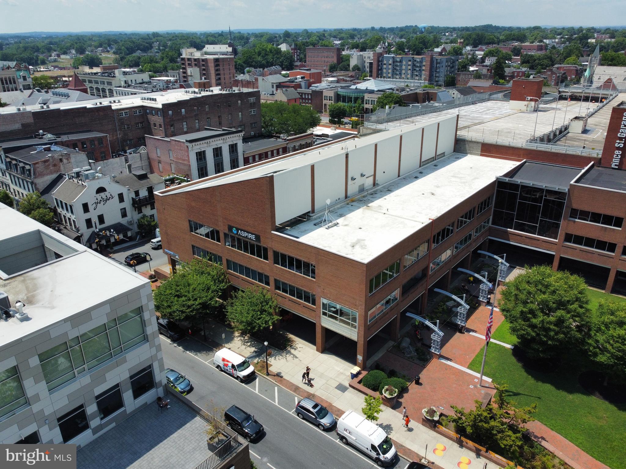 ICONIC PROPERTY in Downtown Lancaster for Owner-Occupant or Investment (projected 7% CAP Rate).
This landmark 3-story brick building plus finished lower level features elevator access to all floors, direct interior connections to the Prince Street Parking Garage, expansive windows, private outdoor space by Binn's Park, indoor/outdoor atrium, custom upgrades, CAT 6 wiring, fob-secured access, auditorium and more. Ideally located one block from Penn Square in the heart of Lancaster City — walkable to the courthouse, Gallery Row, restaurants, hotels and entertainment. 99/100 Walk Score with signage exposure to over 20,000 vehicles per day. The building totals 77,294± SF (62,325± SF above grade) and is zoned CB1. Take advantage of the CRIZ tax, grants and loan incentives. Investor upside potential after lease-up at market rates. Alternatively, the flexible layout, first-floor retail potential and Class A finishes make it well-suited for an owner-occupant seeking a flagship headquarters in an unbeatable downtown location.